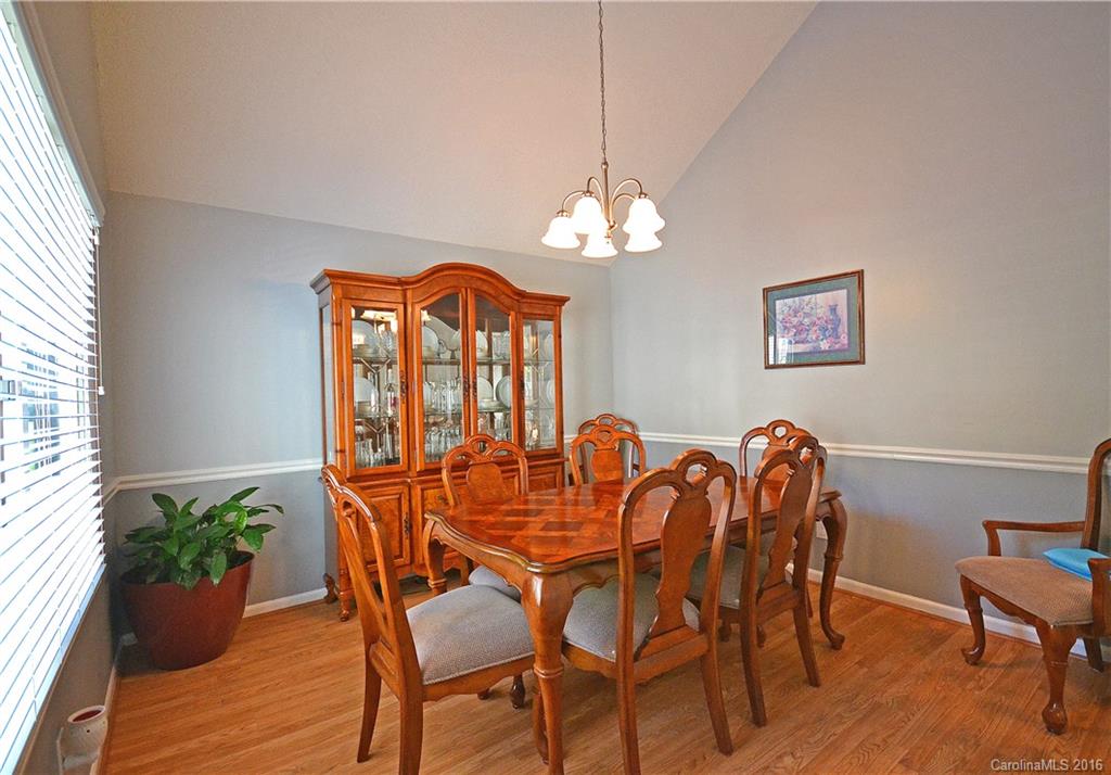 3070 Point Clear Drive Tega Cay, SC 29708 - Photo 3 of 22 a view of a dining room with furniture window and wooden floor