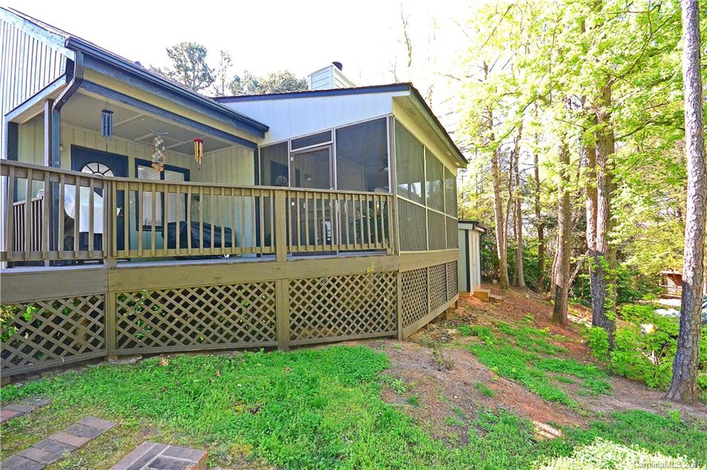 3070 Point Clear Drive Tega Cay, SC 29708 - Photo 21 of 22 a view of a house with a small yard and wooden fence