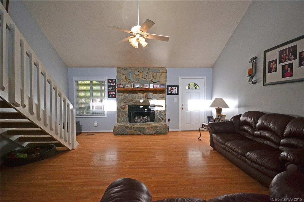 3070 Point Clear Drive Tega Cay, SC 29708 - Photo 5 of 22 a living room with furniture and a chandelier