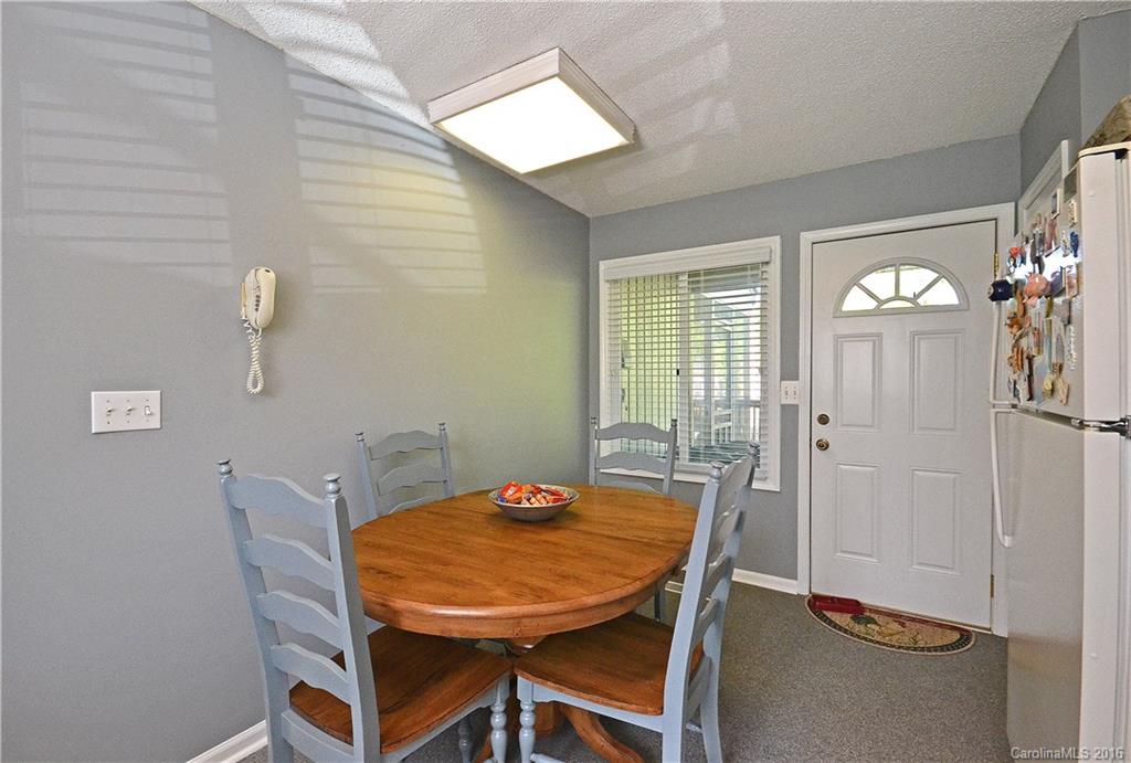 3070 Point Clear Drive Tega Cay, SC 29708 - Photo 9 of 22 a view of a dining room with furniture and window