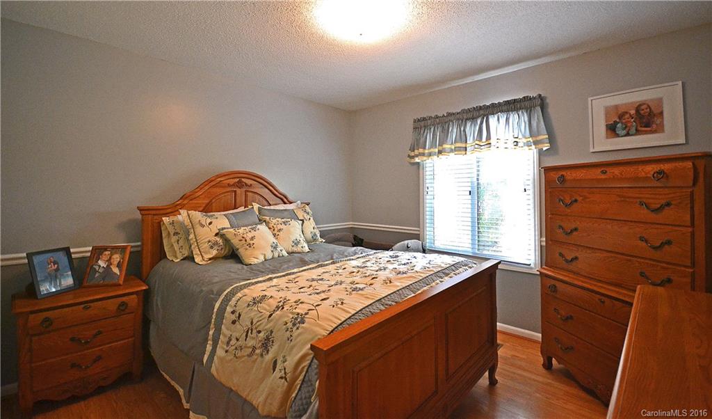 3070 Point Clear Drive Tega Cay, SC 29708 - Photo 10 of 22 a bedroom with a bed and a dresser