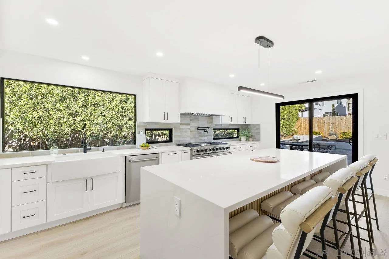 13783 Recuerdo Drive Del Mar, CA 92014 - Photo 15 of 56 a kitchen with appliances cabinets and wooden floor