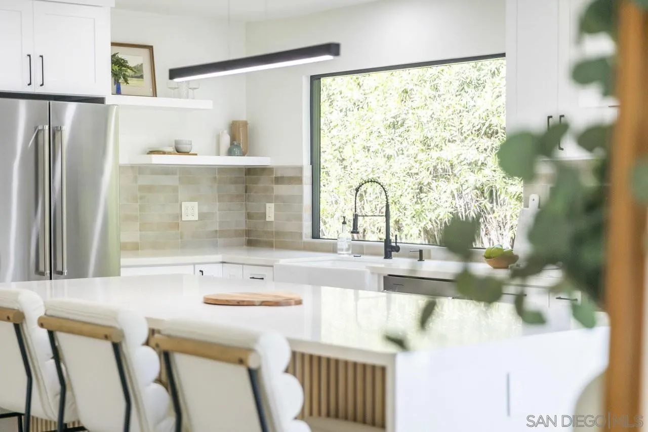 13783 Recuerdo Drive Del Mar, CA 92014 - Photo 17 of 56 a bathroom with a sink a mirror and a shower