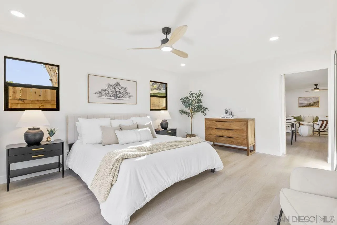 13783 Recuerdo Drive Del Mar, CA 92014 - Photo 27 of 56 a spacious bedroom with a bed and a couch