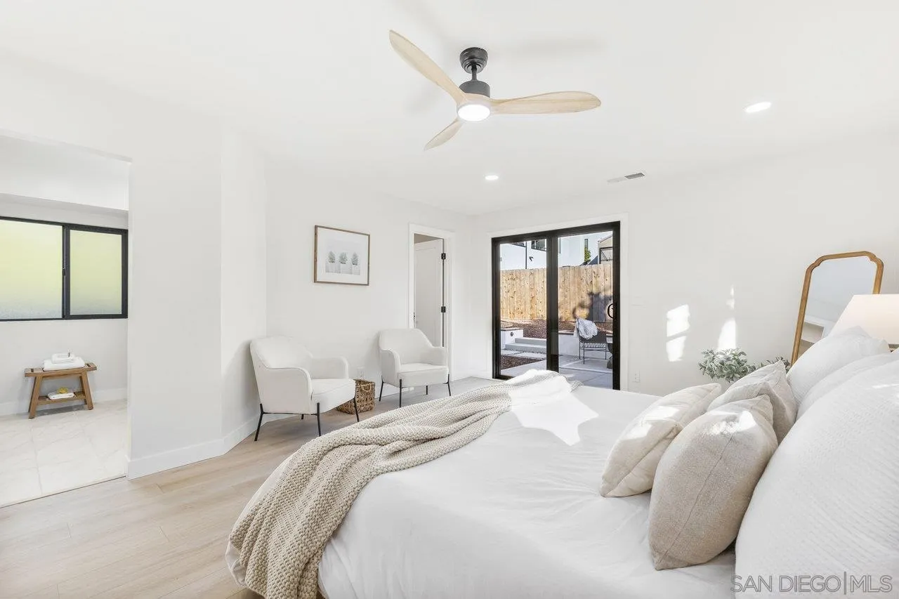 13783 Recuerdo Drive Del Mar, CA 92014 - Photo 28 of 56 a bedroom with a large bed and a chandelier