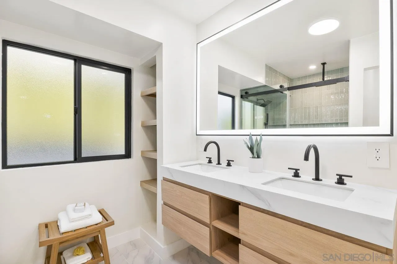 13783 Recuerdo Drive Del Mar, CA 92014 - Photo 30 of 56 a bathroom with a sink and a mirror