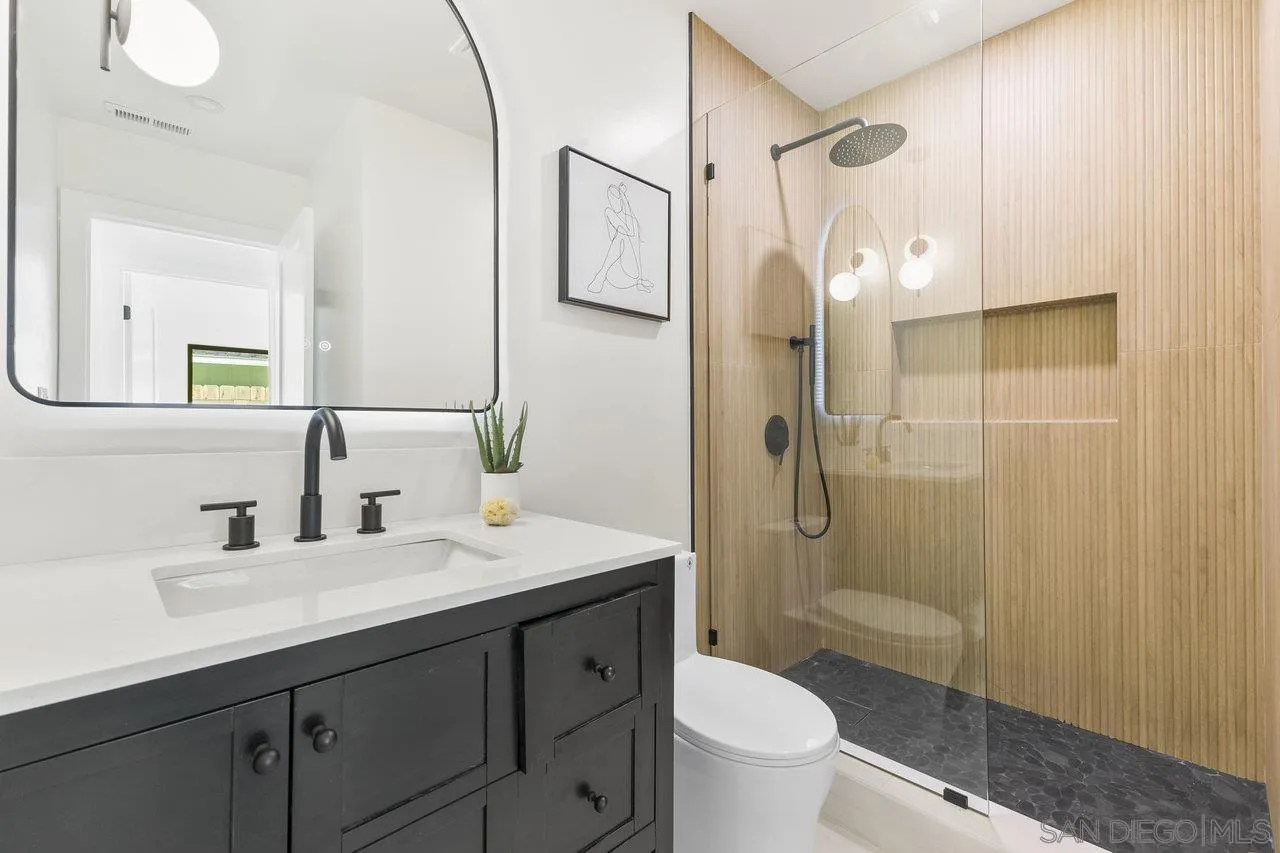 13783 Recuerdo Drive Del Mar, CA 92014 - Photo 37 of 56 a bathroom with a double vanity sink toilet and shower