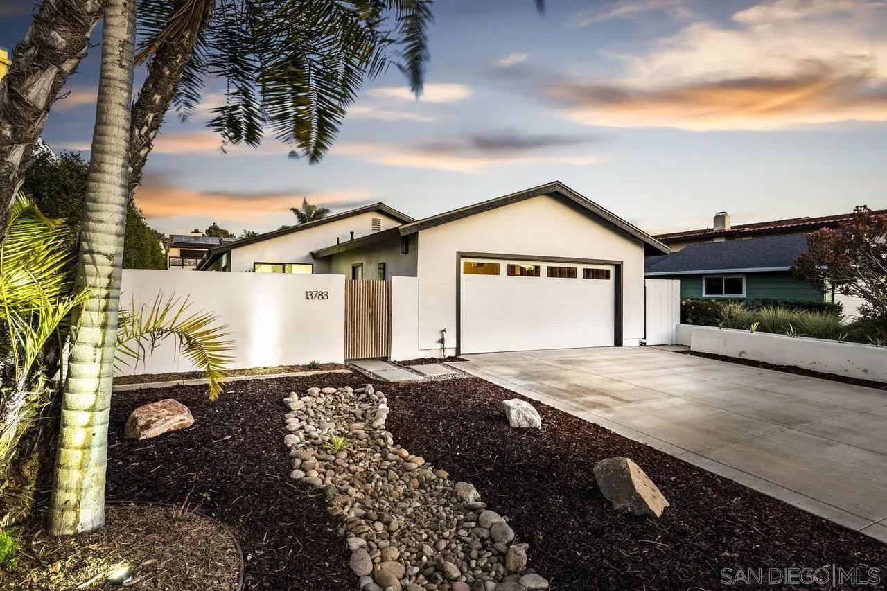 13783 Recuerdo Drive Del Mar, CA 92014 - Photo 4 of 56 a front view of a house with a garden