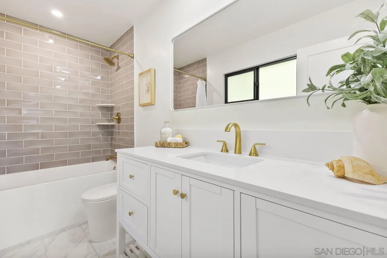 13783 Recuerdo Drive Del Mar, CA 92014 - Photo 41 of 56 a bathroom with a granite countertop sink a toilet and shower