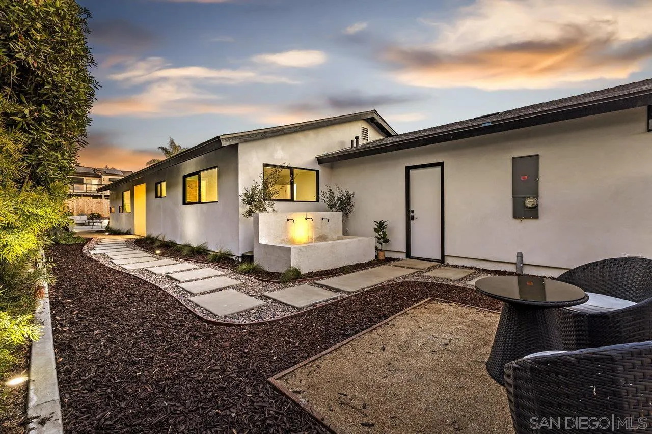 13783 Recuerdo Drive Del Mar, CA 92014 - Photo 8 of 56 a front view of a house with a yard