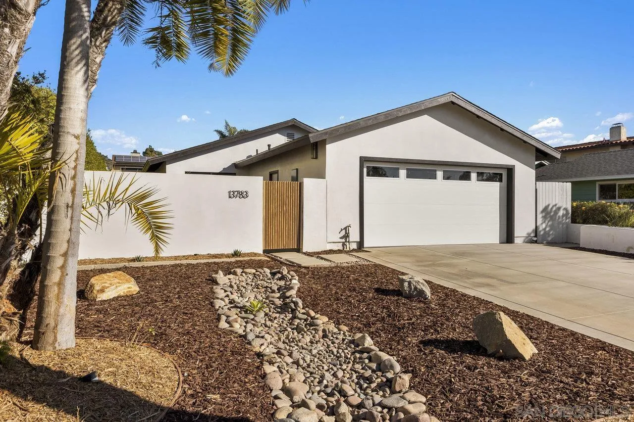 13783 Recuerdo Drive Del Mar, CA 92014 - Photo 9 of 56 a front view of a house with a yard