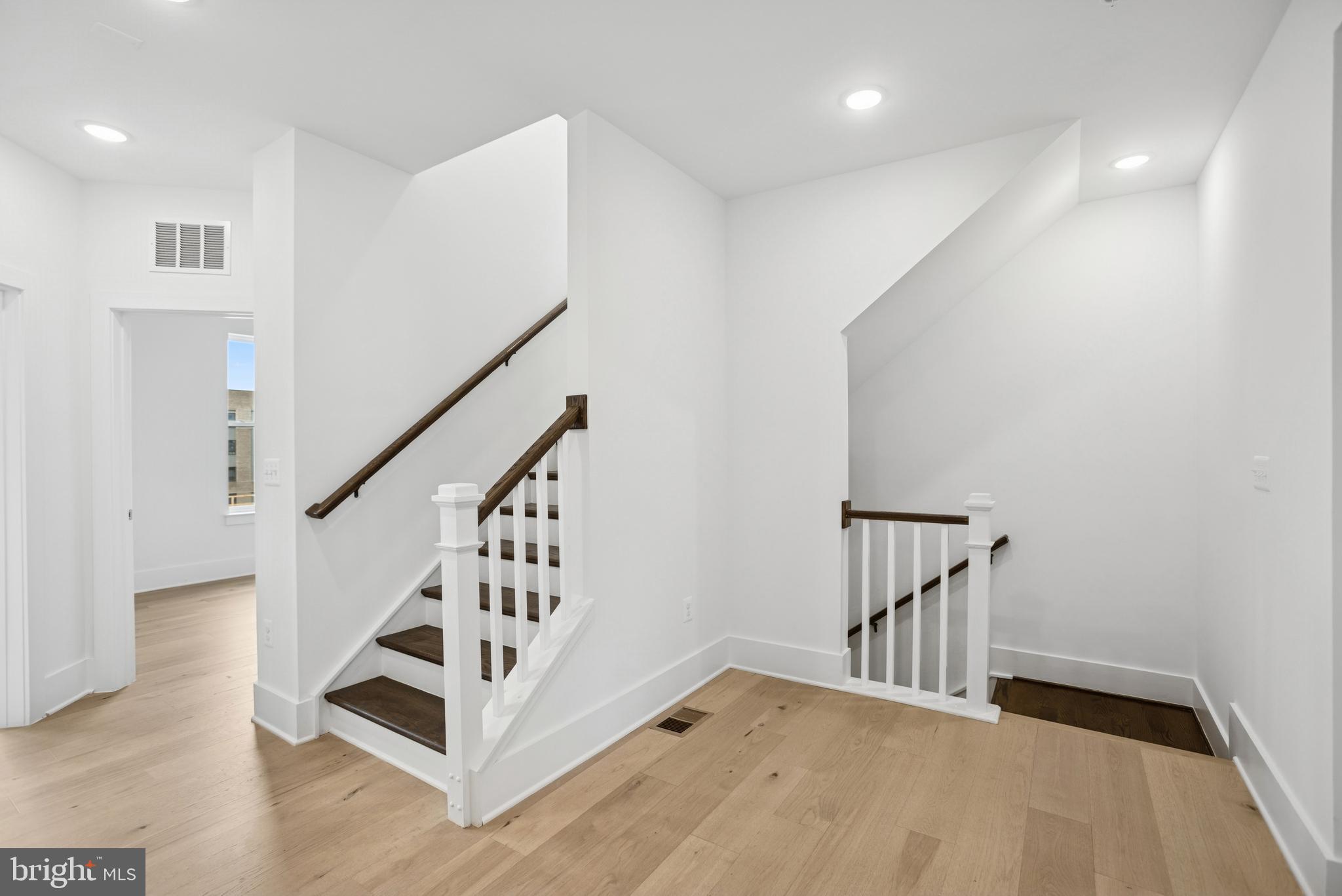 120 B Locke Street, Unit 2025 Baltimore, MD 21230 - Photo 22 of 31 a view of entryway with stairs and wooden floor