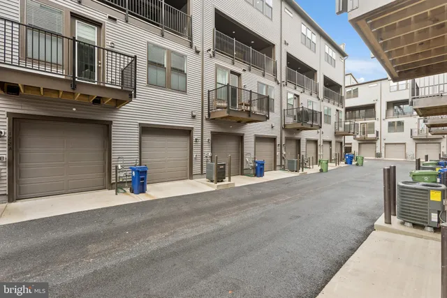 a front view of a building with a road