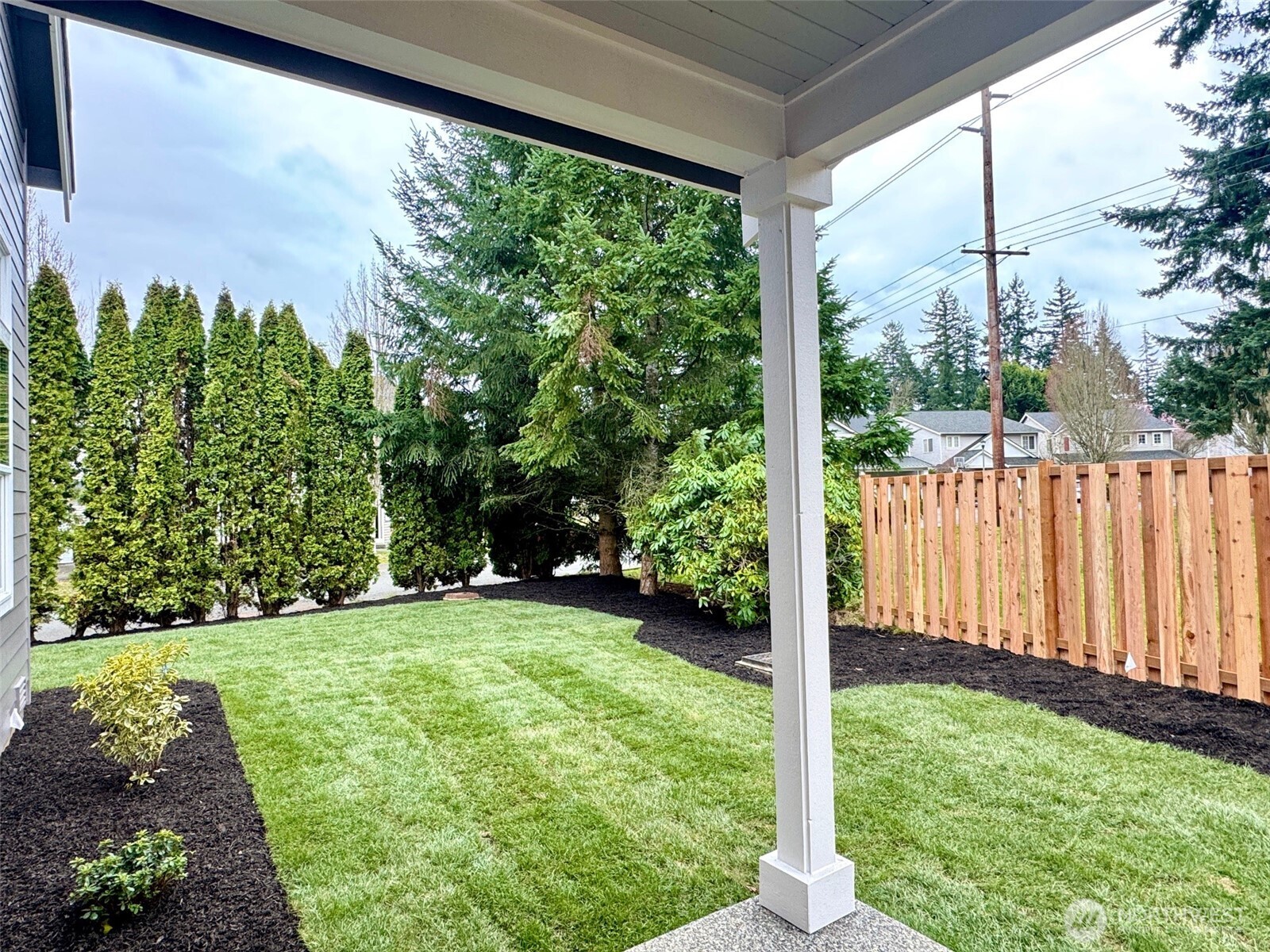 9207 Northeast 175th Street, Unit B Bothell, WA 98011 - Photo 14 of 33 a view of a porch with a yard