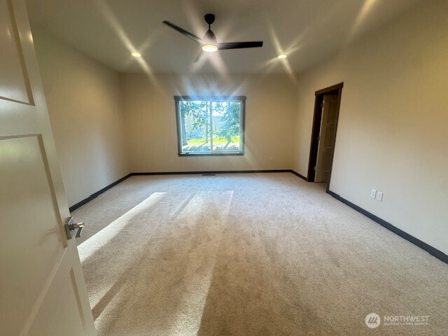 9207 Northeast 175th Street, Unit B Bothell, WA 98011 - Photo 18 of 33 an empty room with windows and fan