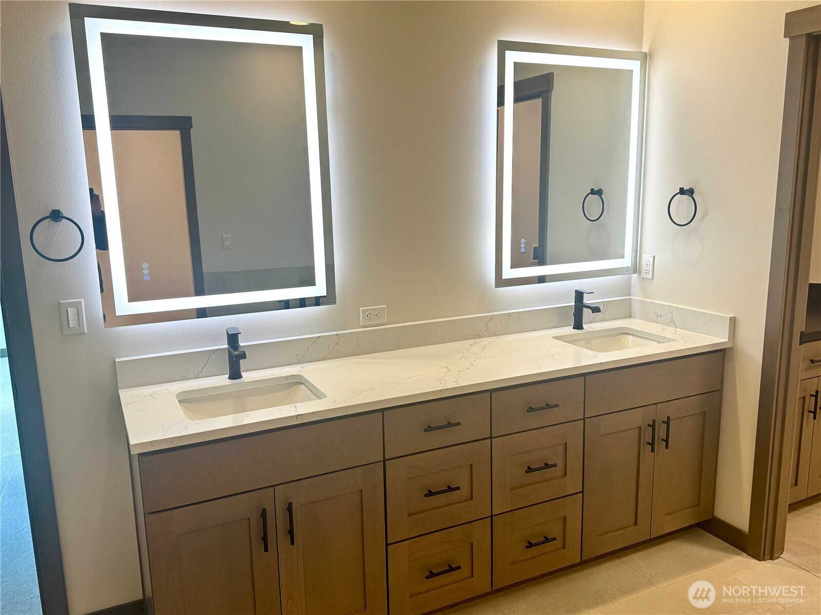 9207 Northeast 175th Street, Unit B Bothell, WA 98011 - Photo 20 of 33 a bathroom with double sink and a mirror