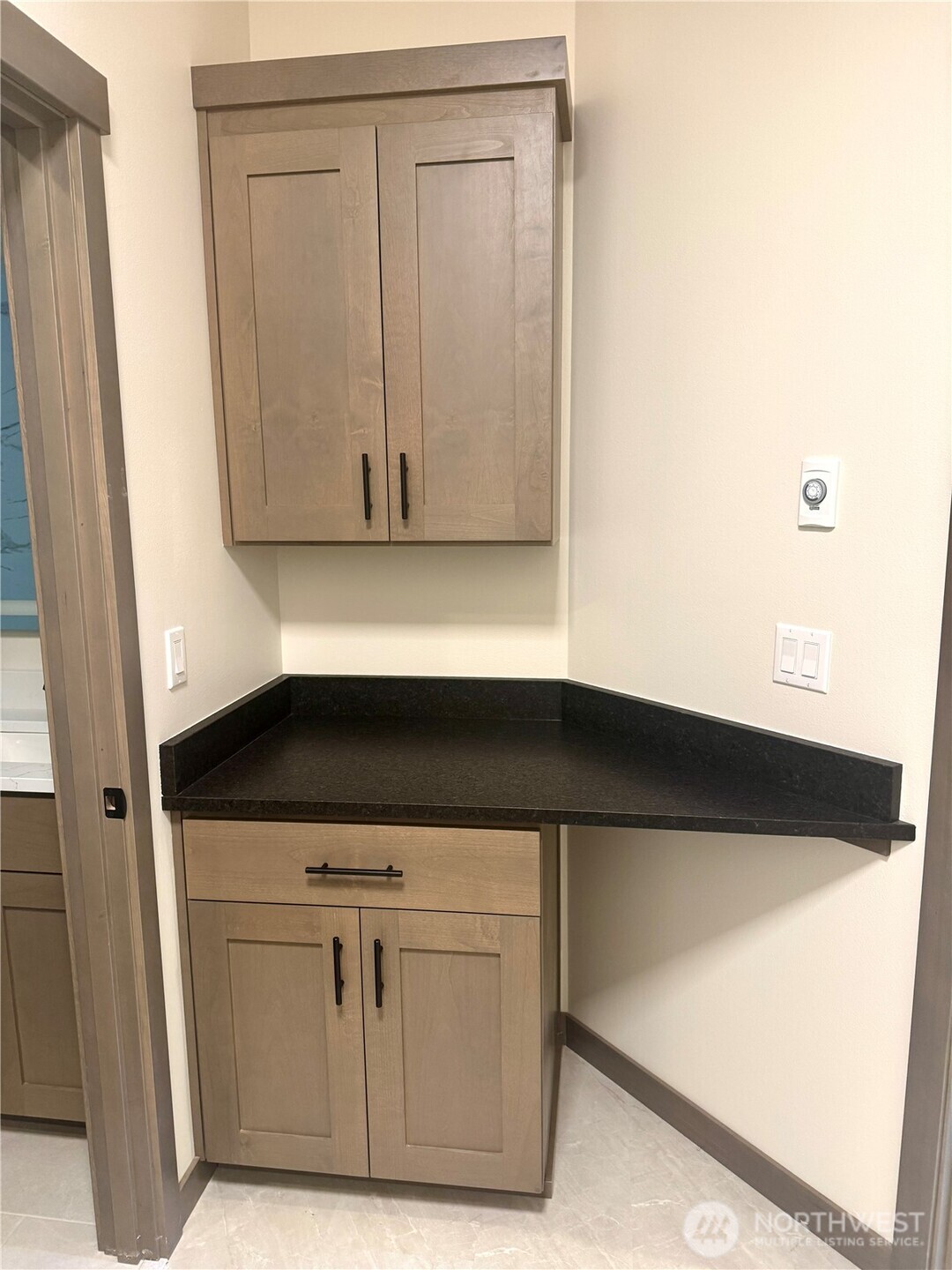 9207 Northeast 175th Street, Unit B Bothell, WA 98011 - Photo 24 of 33 a view of a kitchen with white cabinets