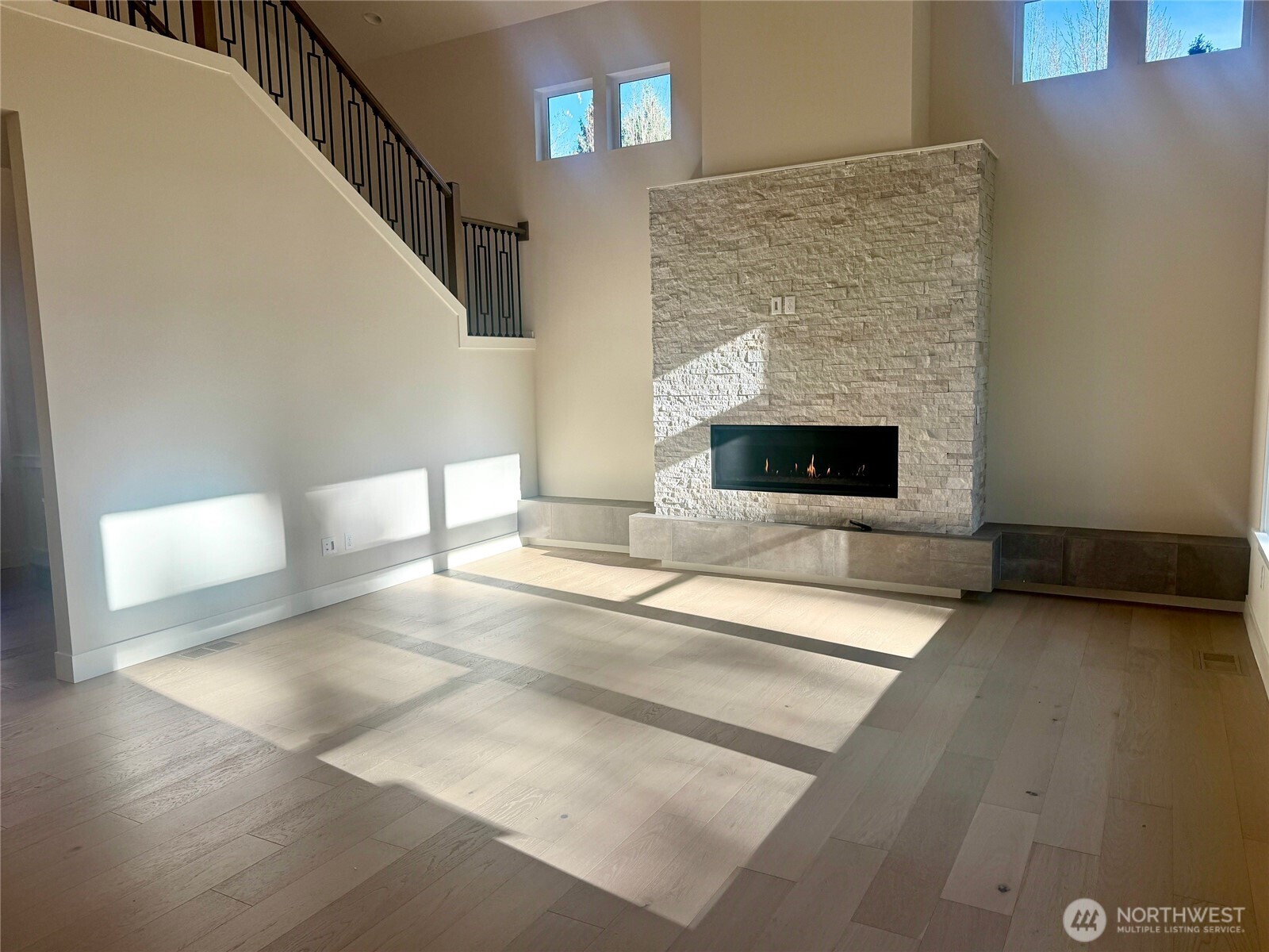 9207 Northeast 175th Street, Unit B Bothell, WA 98011 - Photo 3 of 33 a living room with furniture and a fireplace