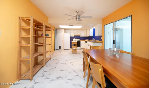 a open kitchen with kitchen island a stove a sink and a refrigerator