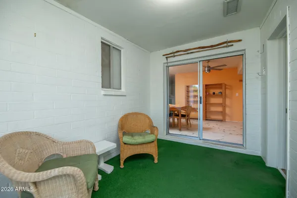 a room with pool table and windows