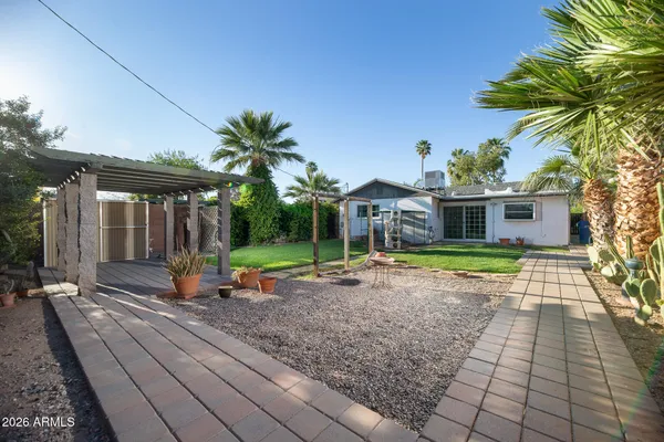 a view of house with swimming pool outdoor seating