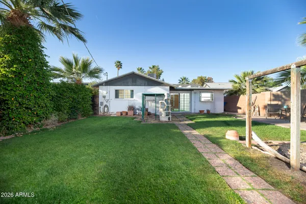 a front view of a house with a yard and porch