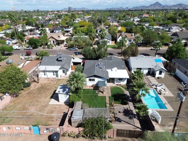 an aerial view of residential houses with outdoor space