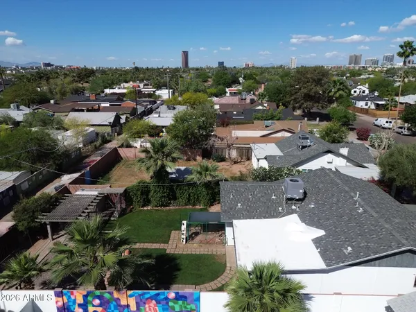 an aerial view of residential houses with outdoor space