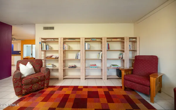 a rug sitting in a living room with furniture and a rug