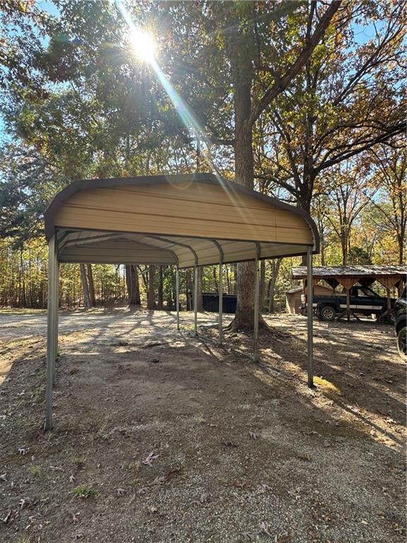 2193 Ruckersville Road Elberton, GA 30635 - Photo 4 of 6 a view of patio with a table and chairs under an umbrella
