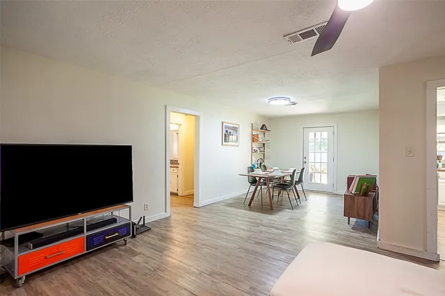 a view of a livingroom with furniture and a flat screen tv
