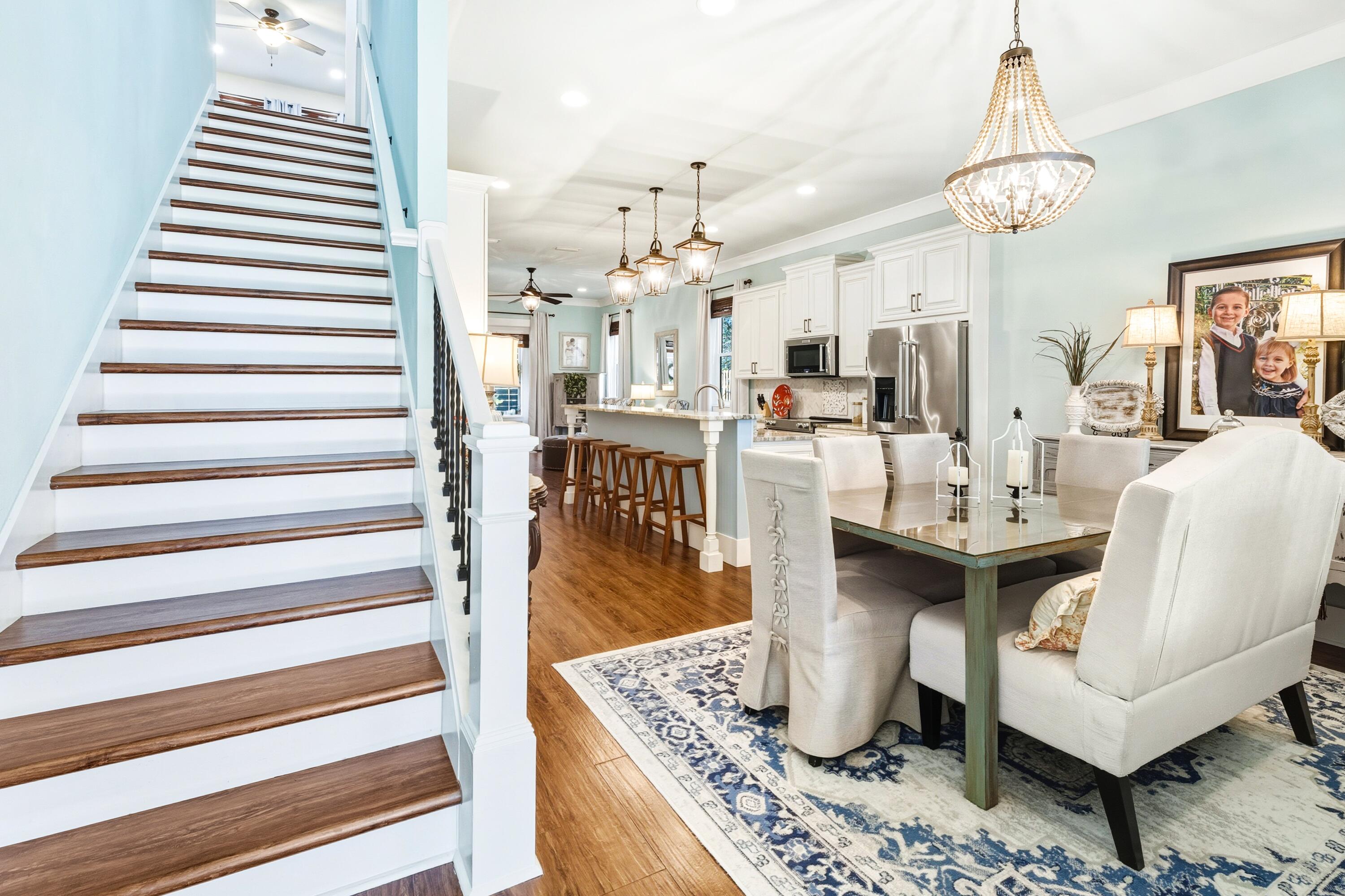 101 Botany Boulevard Santa Rosa Beach, FL 32459 - Photo 14 of 53 a living room with fireplace furniture and a chandelier