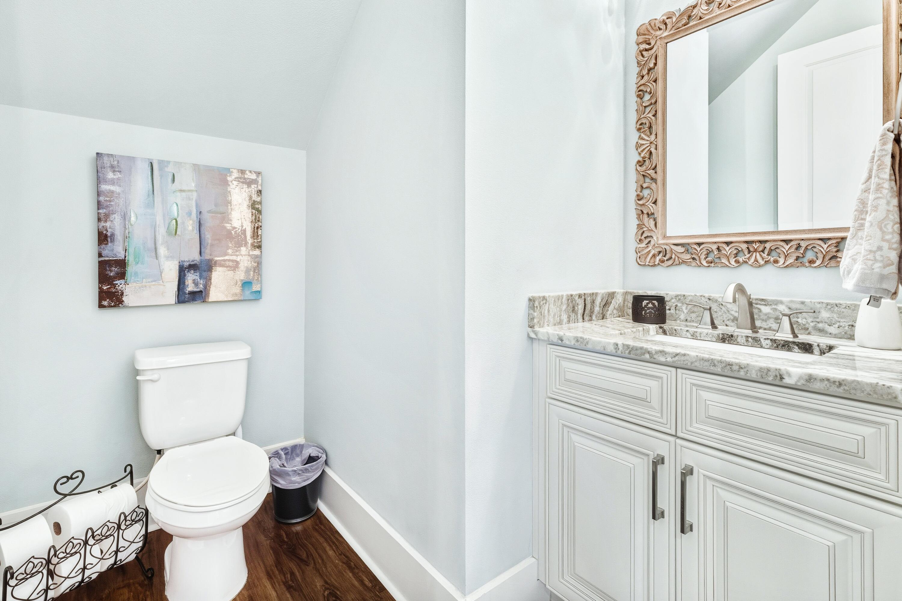 101 Botany Boulevard Santa Rosa Beach, FL 32459 - Photo 29 of 53 a bathroom with a granite countertop toilet sink and mirror