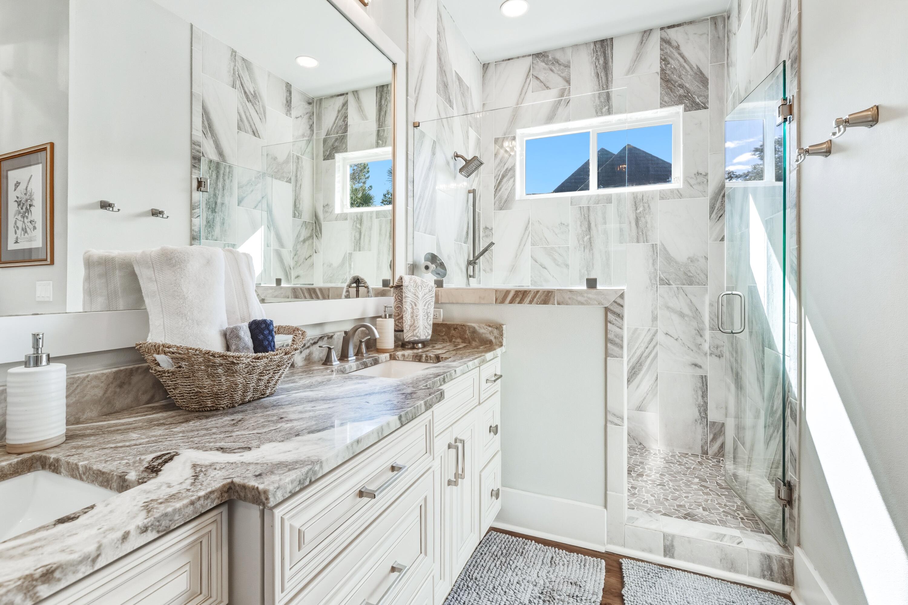 101 Botany Boulevard Santa Rosa Beach, FL 32459 - Photo 36 of 53 a bathroom with a granite countertop sink and a shower