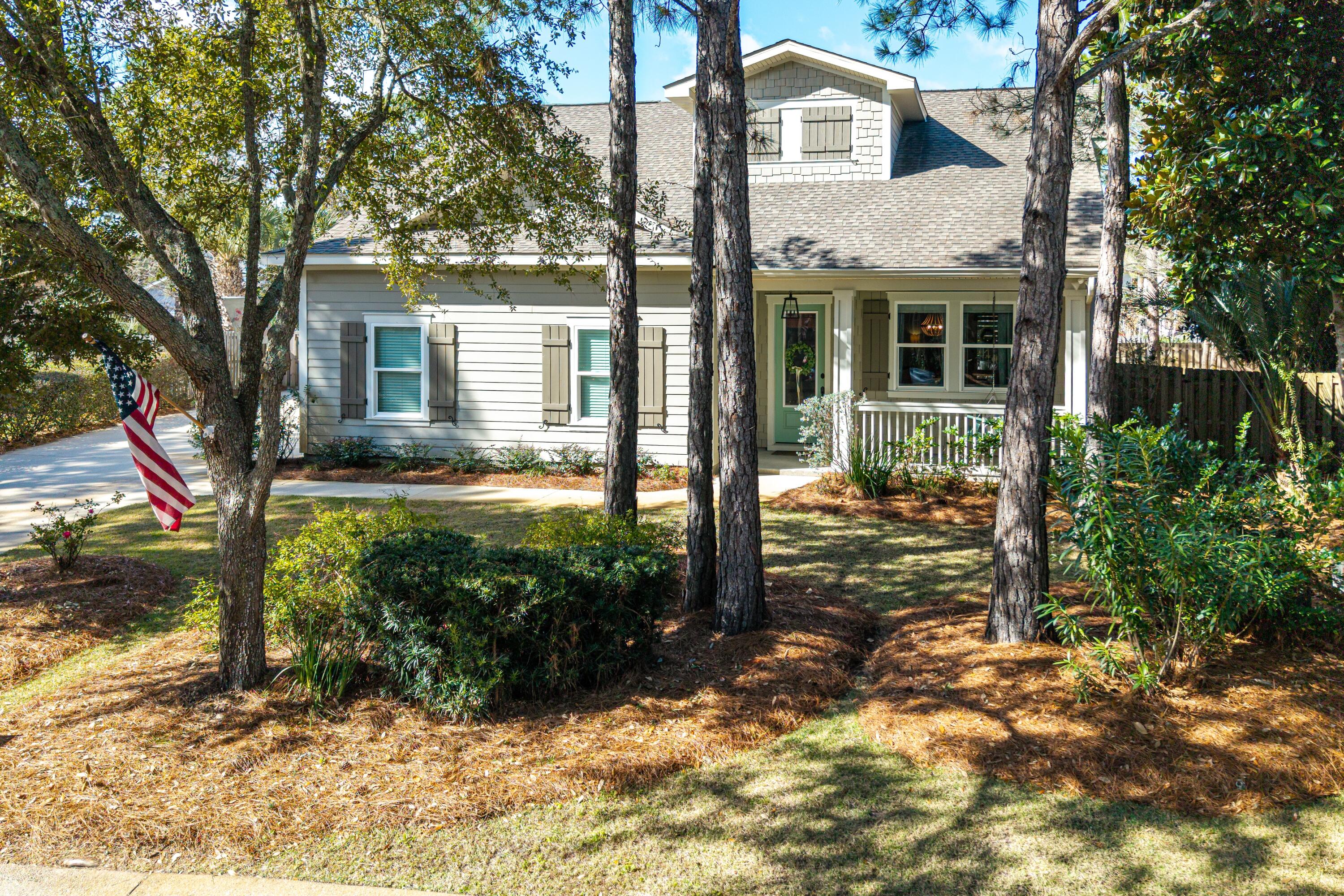 101 Botany Boulevard Santa Rosa Beach, FL 32459 - Photo 4 of 53 a view of a house with backyard and garden