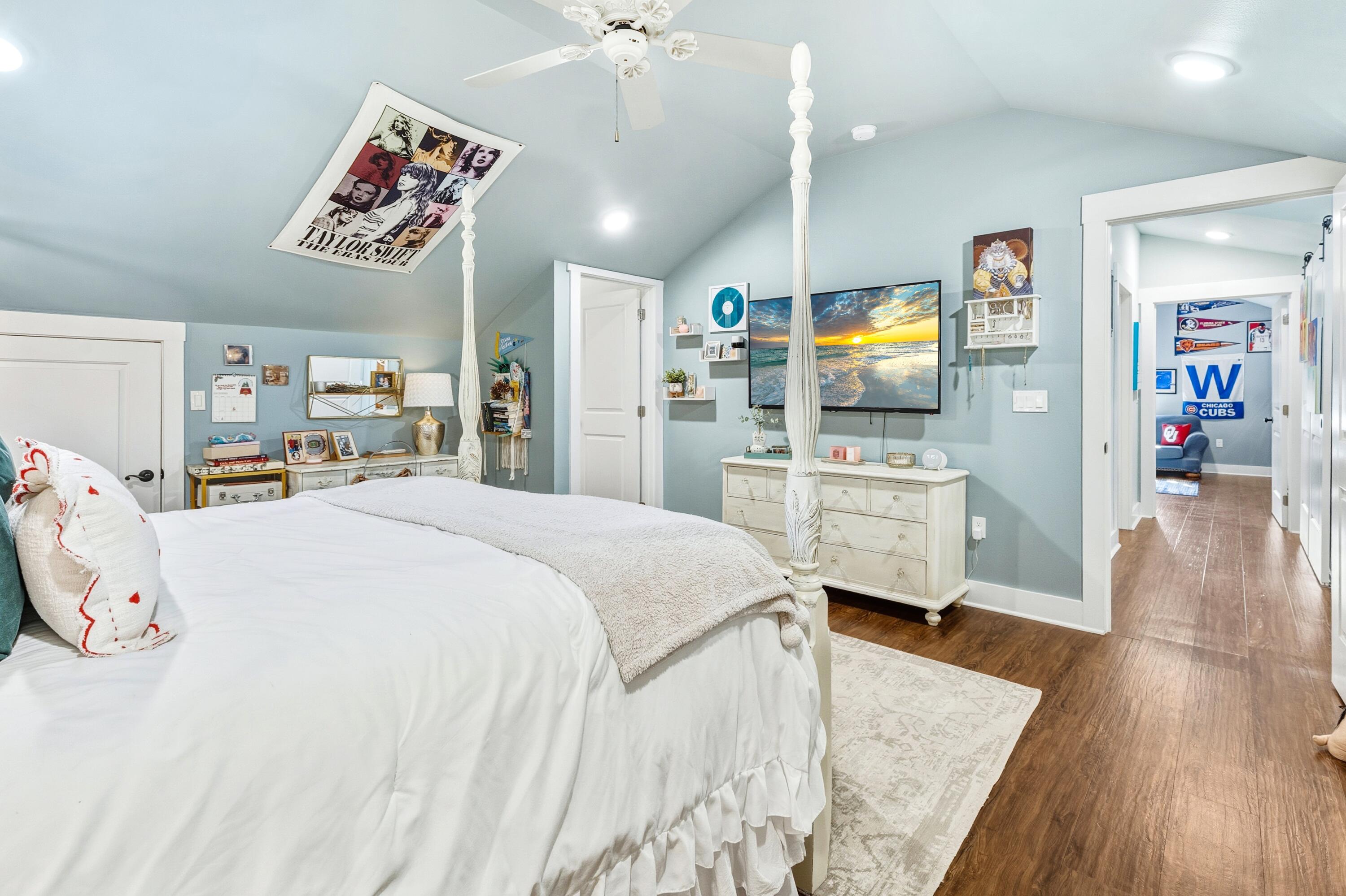 101 Botany Boulevard Santa Rosa Beach, FL 32459 - Photo 41 of 53 a spacious bedroom with a bed a dresser and wooden floor