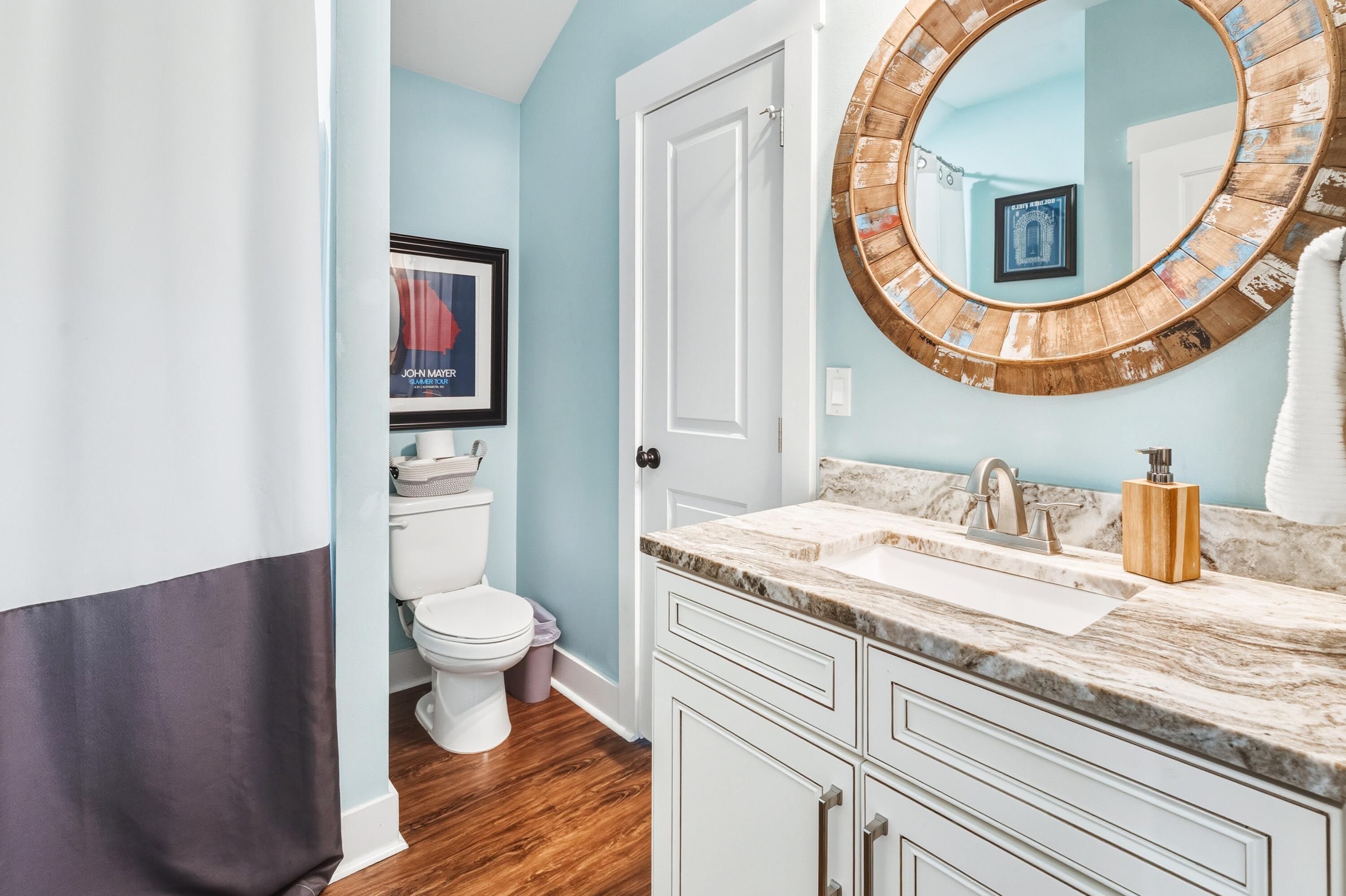 101 Botany Boulevard Santa Rosa Beach, FL 32459 - Photo 45 of 53 a bathroom with a toilet a sink and a mirror