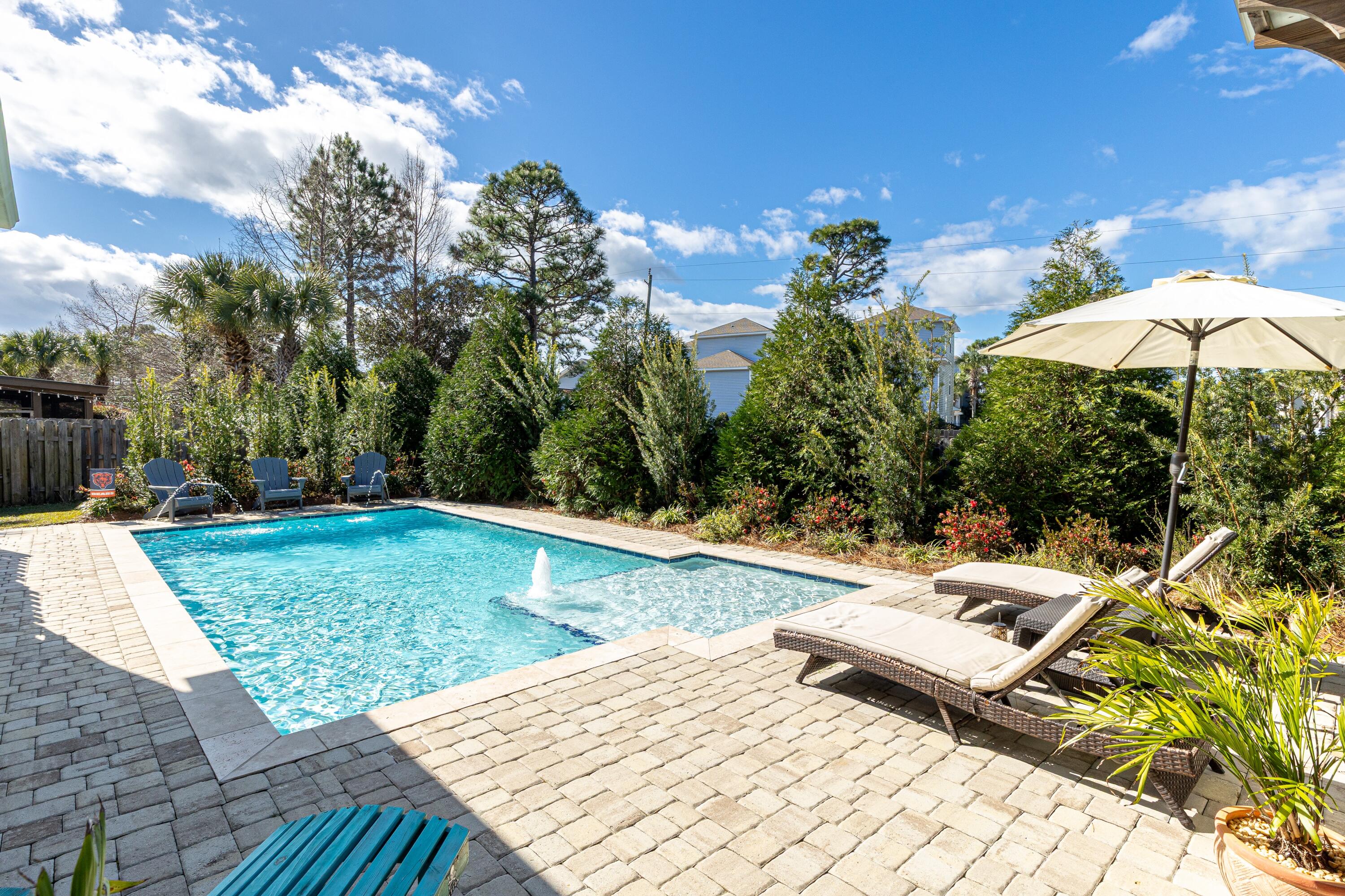 101 Botany Boulevard Santa Rosa Beach, FL 32459 - Photo 48 of 53 a view of a backyard with sitting area
