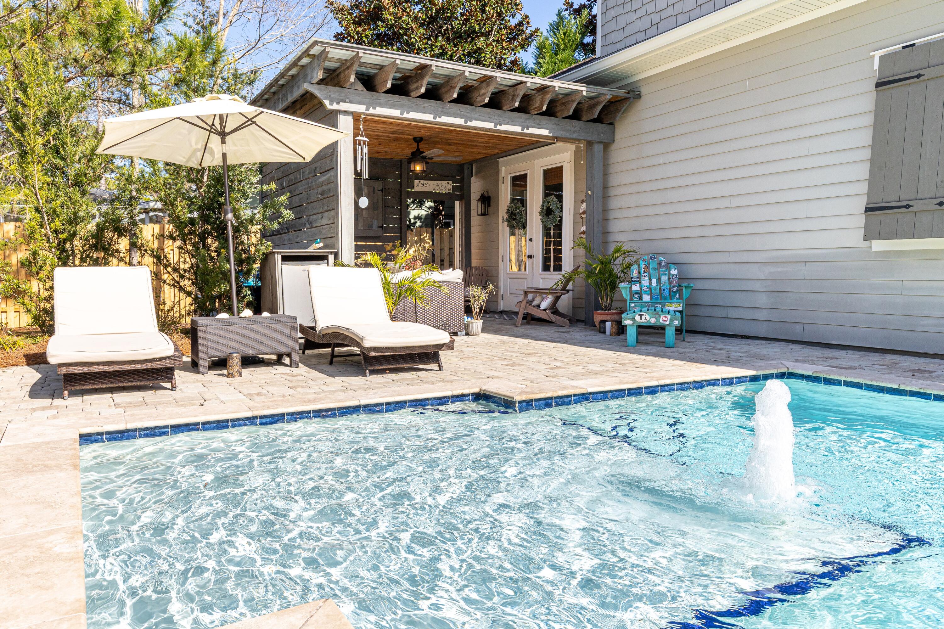 101 Botany Boulevard Santa Rosa Beach, FL 32459 - Photo 49 of 53 a view of a house with backyard and sitting area