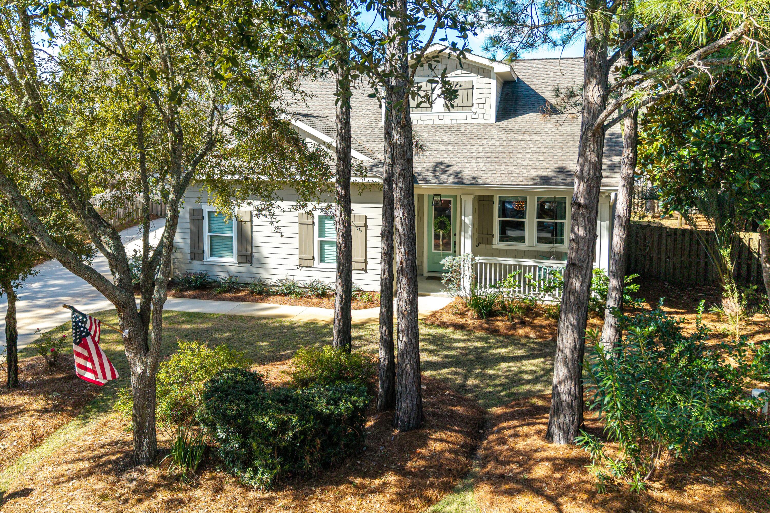 101 Botany Boulevard Santa Rosa Beach, FL 32459 - Photo 5 of 53 a view of a patio with table and chairs and potted plants