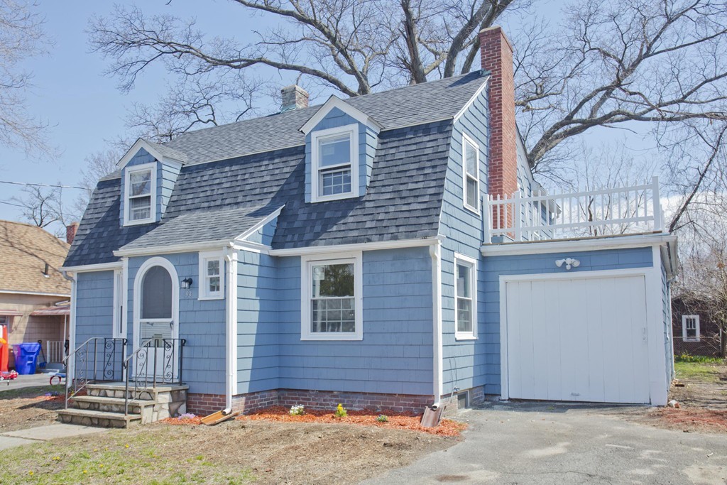 93 Haskin Street Springfield, MA 01109 - Photo 1 of 27 a front view of a house with a yard