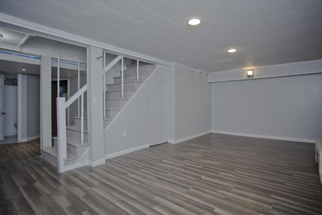 93 Haskin Street Springfield, MA 01109 - Photo 23 of 27 an empty room with wooden floor and entryway