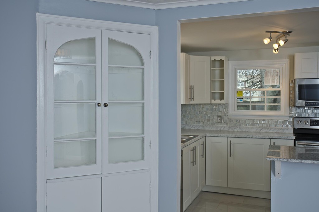 93 Haskin Street Springfield, MA 01109 - Photo 8 of 27 a bathroom with a granite countertop sink a vanity and a mirror