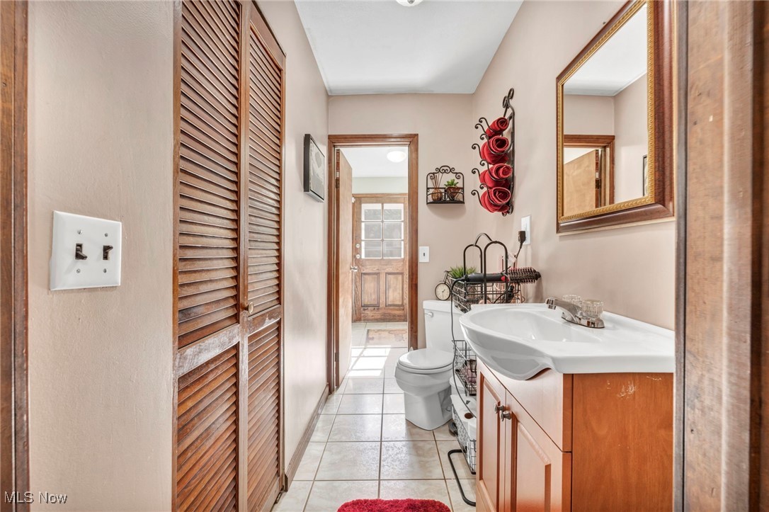 8164 Edgewood Road Mentor, OH 44060 - Photo 20 of 42 Bathroom with vanity, toilet, and tile patterned floors