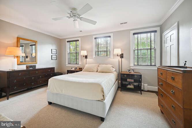 3629 Everett Street Northwest Washington, DC 20008 - Photo 20 of 51 a bedroom with a large bed and a dresser