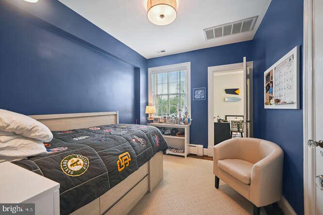 3629 Everett Street Northwest Washington, DC 20008 - Photo 26 of 51 a bedroom with bed and a couch