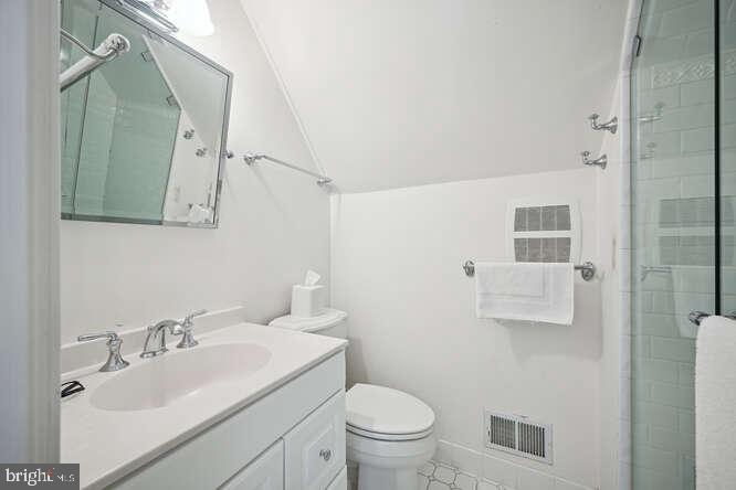 3629 Everett Street Northwest Washington, DC 20008 - Photo 34 of 51 a bathroom with a sink toilet and mirror