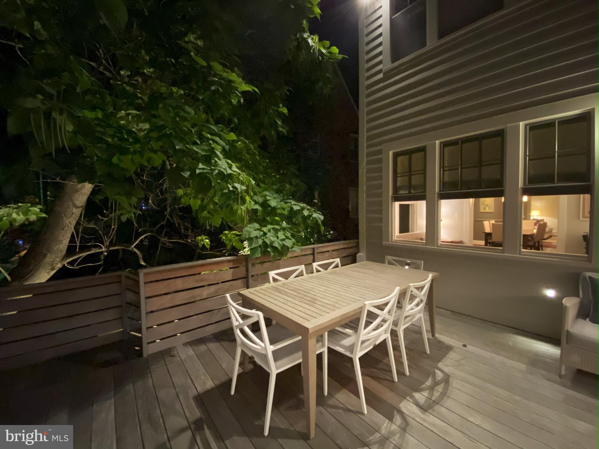3629 Everett Street Northwest Washington, DC 20008 - Photo 41 of 51 a view of a patio with table and chairs with wooden floor and fence