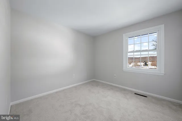 a room with a sink and a mirror