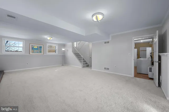 a view of bathroom with a sink and a mirror